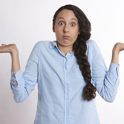 woman with arms up in confusion